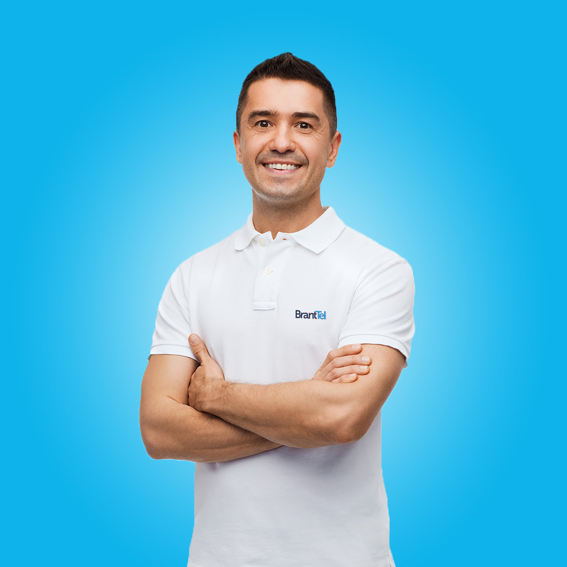 smiling man in white t-shirt with crossed arms Trusted Advisor